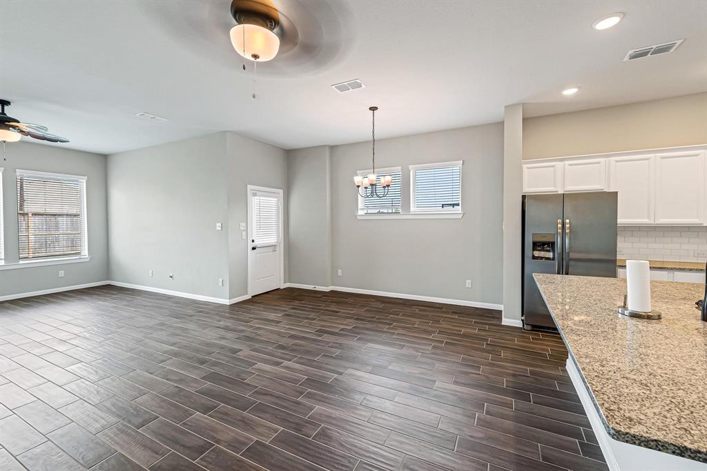 Here\'s another view showcasing the formal dining space and breakfast bar.