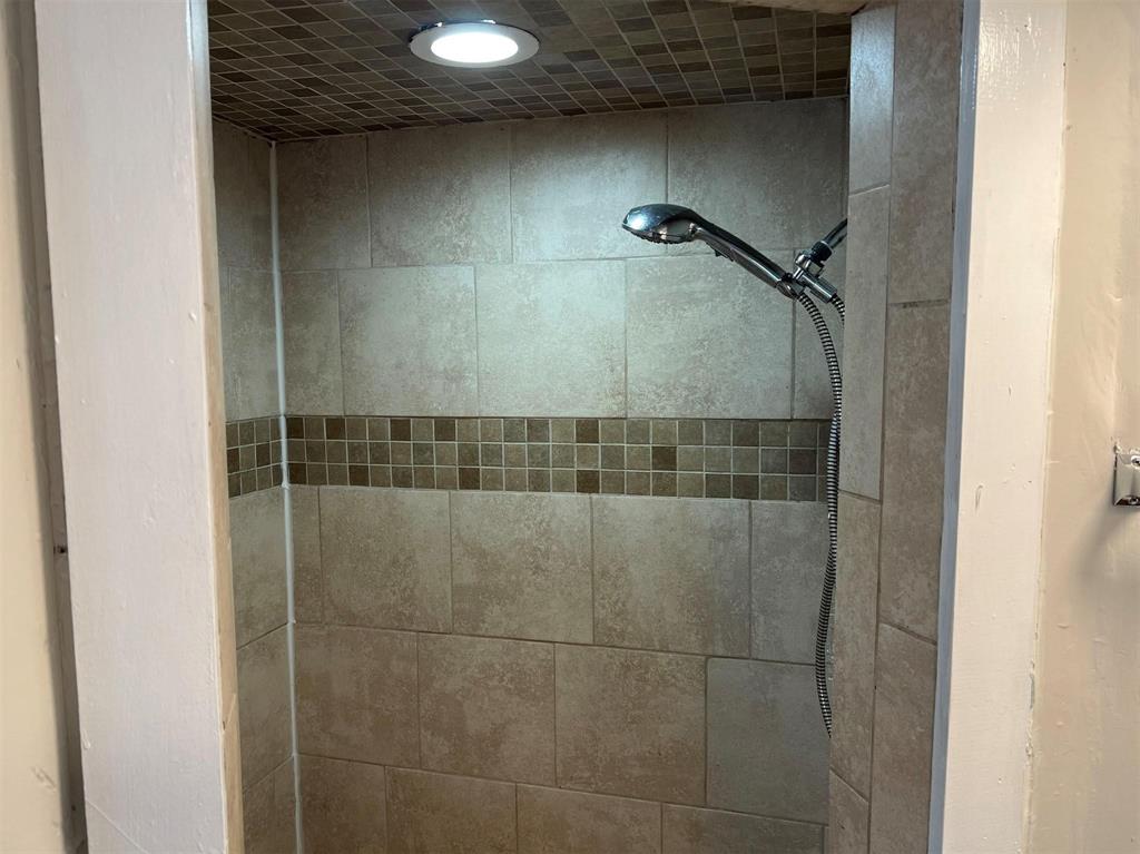 Primary bathroom with tiled shower