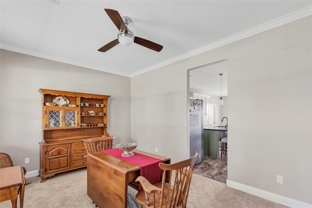 Formal dining opens to kitchen area