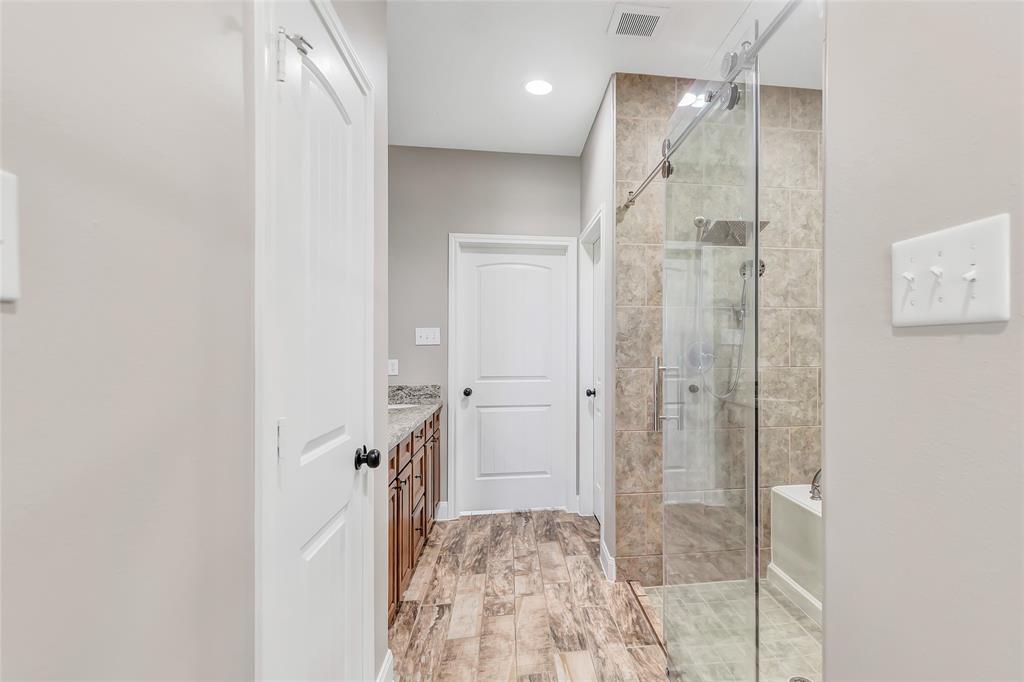 Primary bath with his and hers closets