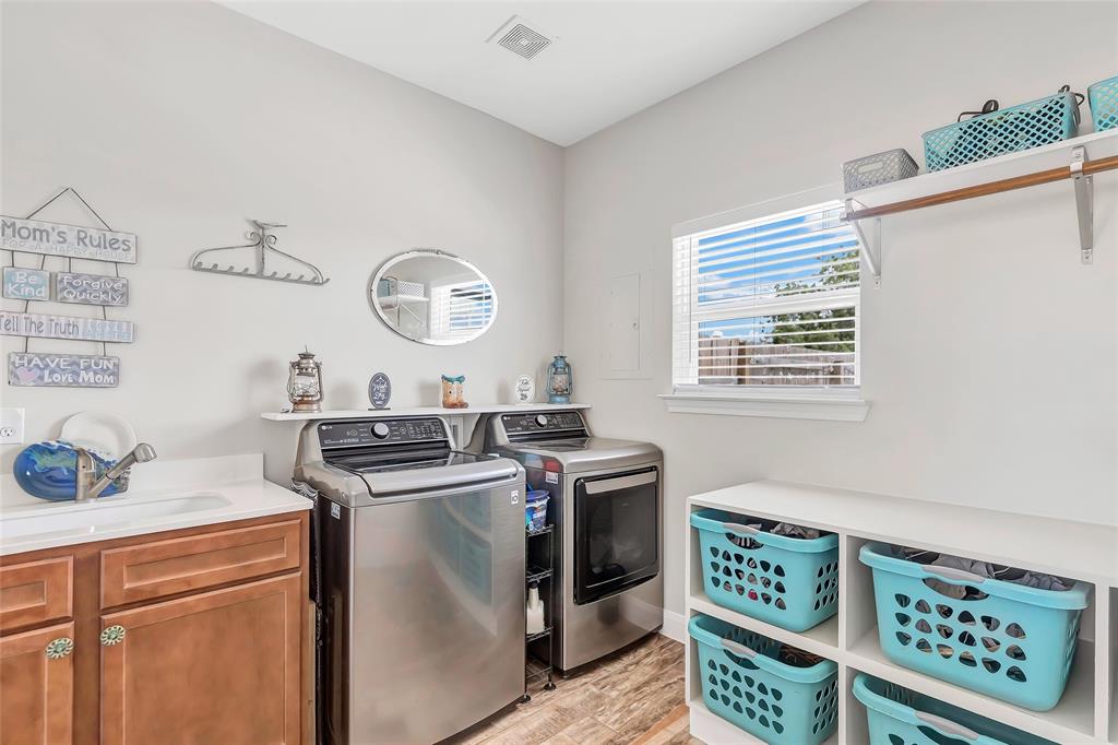 Laundry room with built in basket storage and sink