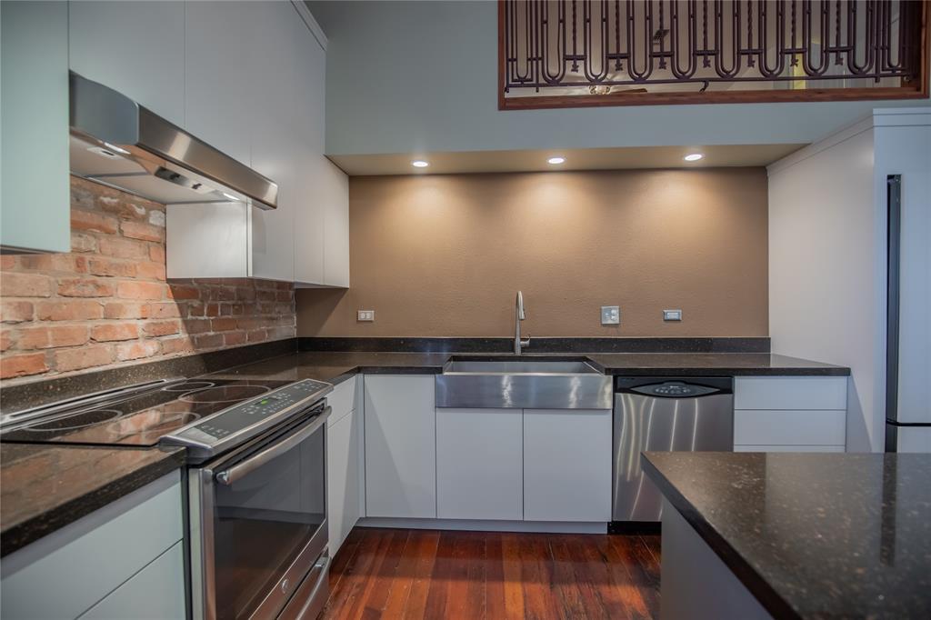 The stainless steel apron sink and the induction stove makeup this wonderful kitchen