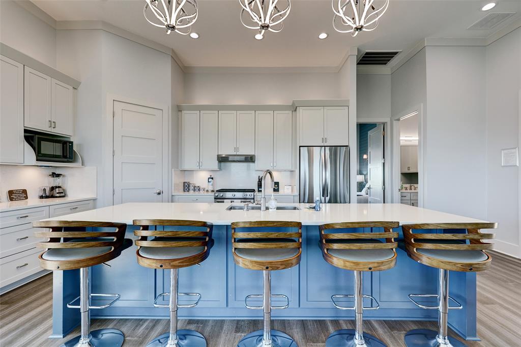 Large Kitchen With Oversized Island, Stainless Steel Appliances and Custom Cabinets