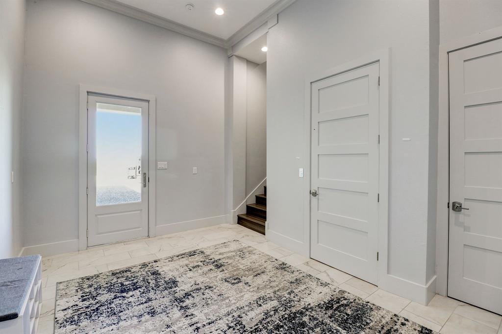 First Floor Foyer With Access to Elevator, Garage and Stairwell