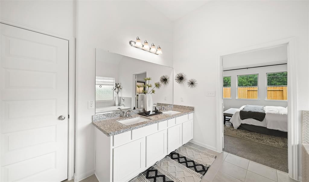 Double sinks in owner\'s bath (*Photo not of actual home and used for illustration purposes only.)