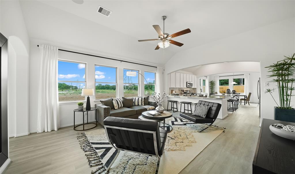 The great room opens to the kitchen. (*Photo not of actual home and used for illustration purposes only.)