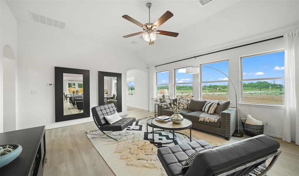 Great room features wall of windows for plenty of natural light. (*Photo not of actual home and used for illustration purposes only.)