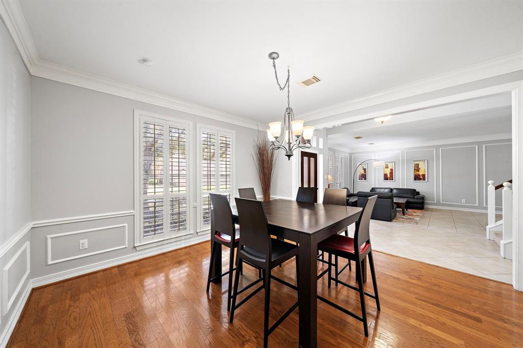 Located right off the spacious den, the dining room can easily seat a large group of guests while leaving plenty of space to move around.