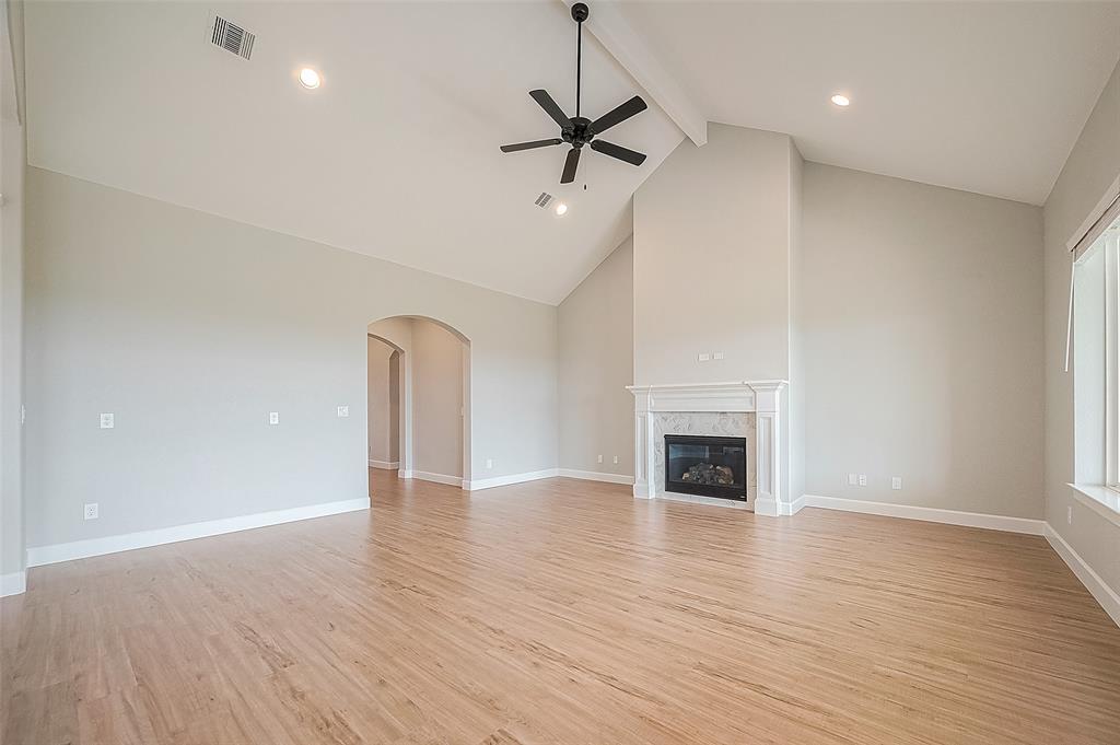 Oversized Family Room with 18 ft Ceilings and Fireplace