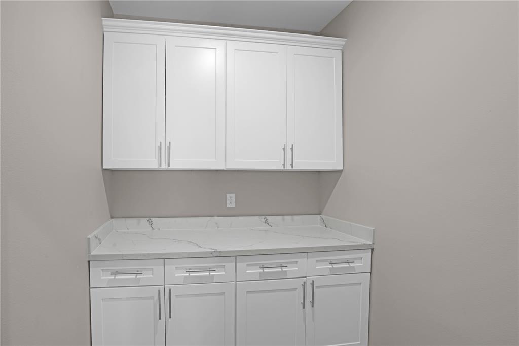 Extra cabinets in bonus utility pantry area.