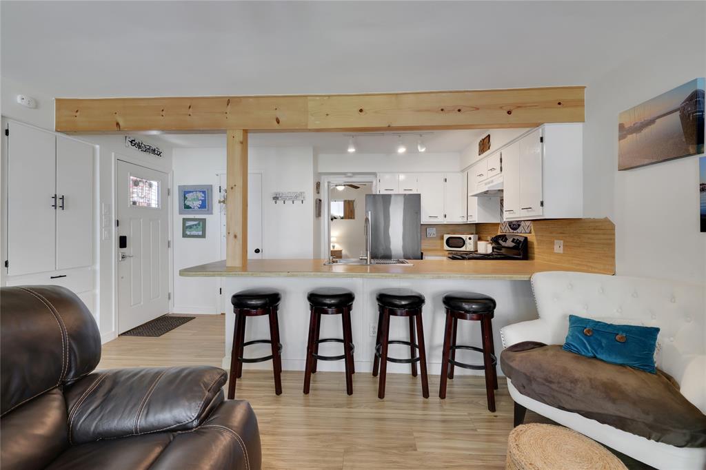 Wood look laminate flooring throughout the living area