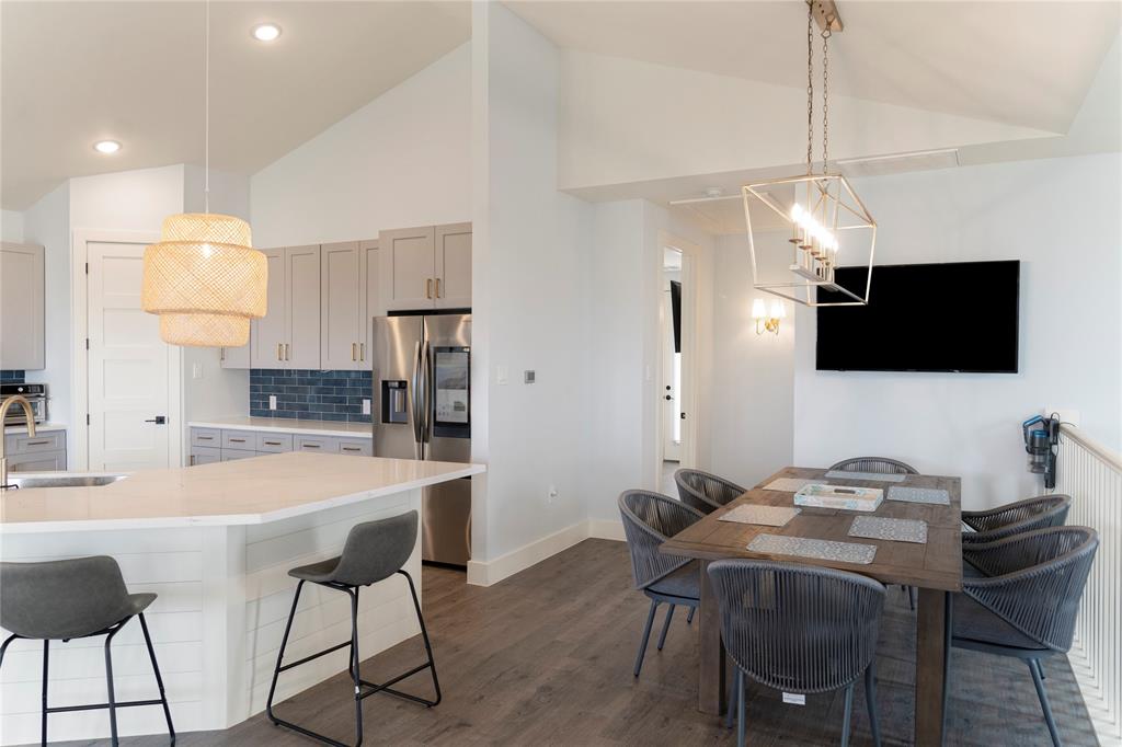 The kitchen has plenty of custom cabinets, and beautiful quartz countertops.