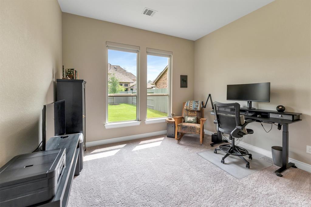 Second bedroom downstairs being used as an additional office