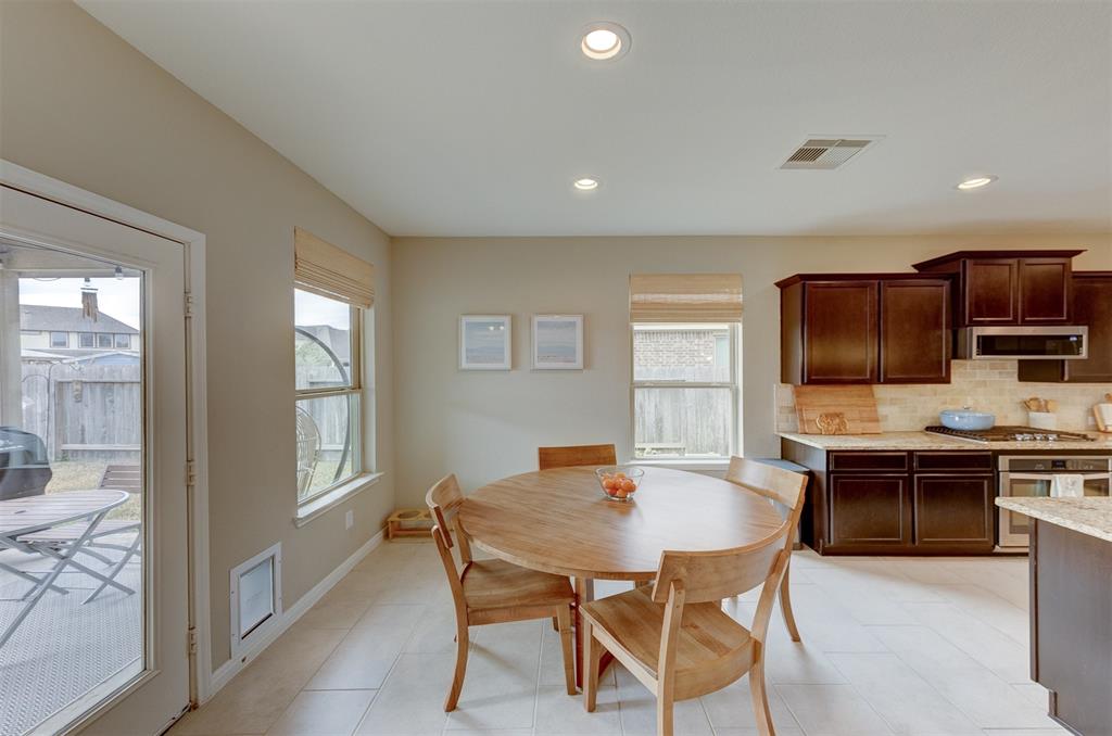 The breakfast area is bright and inviting. Easy access to the covered rear patio makes entertaining a breeze.