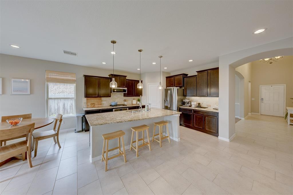 The kitchen is formed around the massive island that incorporates a breakfast bar.