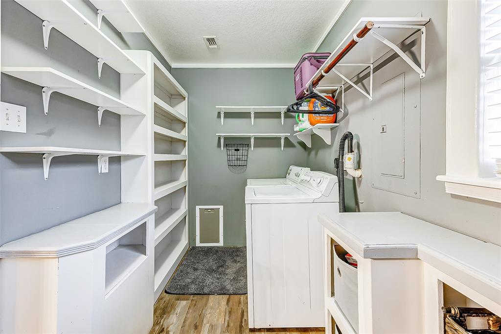 Step into modern convenience and style! This picture-perfect pantry and utility room offer both functionality and elegance, making everyday tasks a delight.