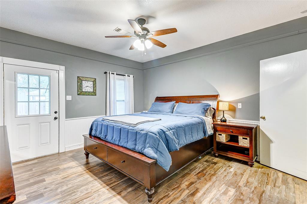 Step into relaxation and luxury! This serene primary bedroom invites you to unwind with direct access to the backyard porch, seamlessly blending indoor comfort with outdoor serenity.