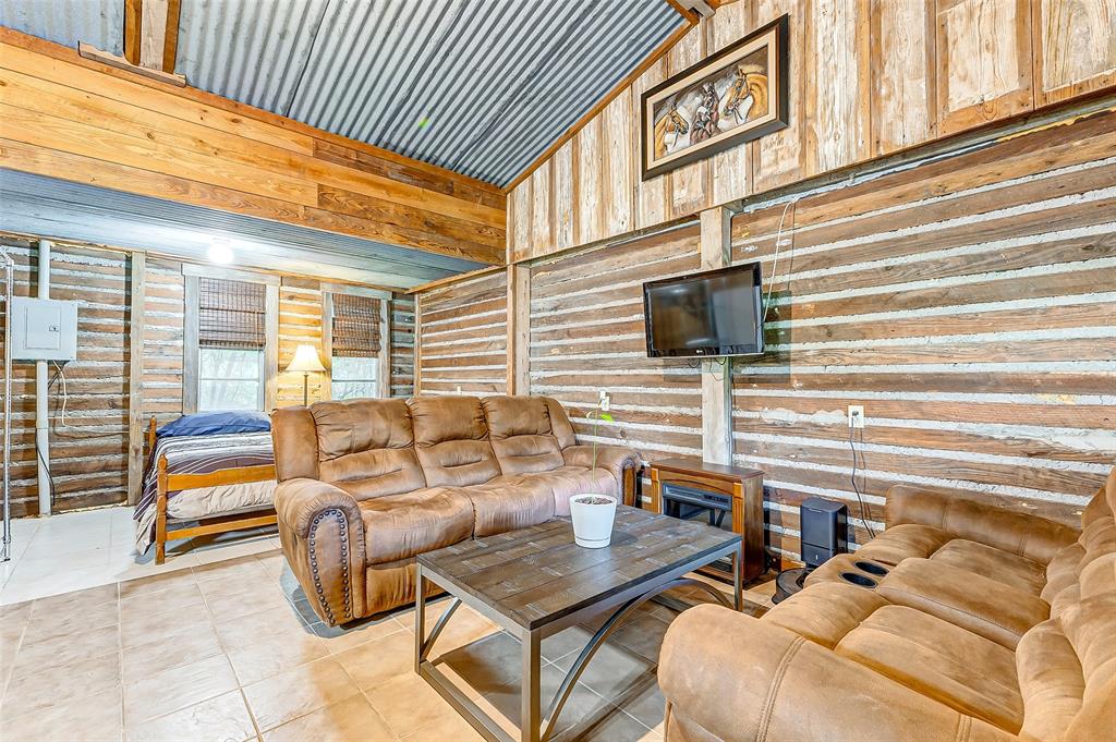 This inviting living room in the ultimate man cave or cozy mother-in-law suite offers the perfect space to unwind and entertain. Experience relaxation like never before in this versatile retreat.