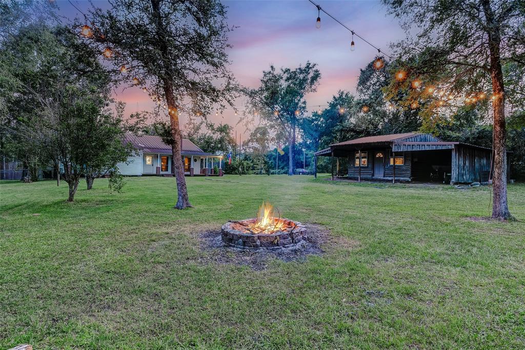 Entertain under the stars in this enchanting backyard retreat, where the glow of the outdoor fire pit sets the scene for unforgettable gatherings. Welcome to your own slice of paradise, where every moment is filled with warmth and charm.