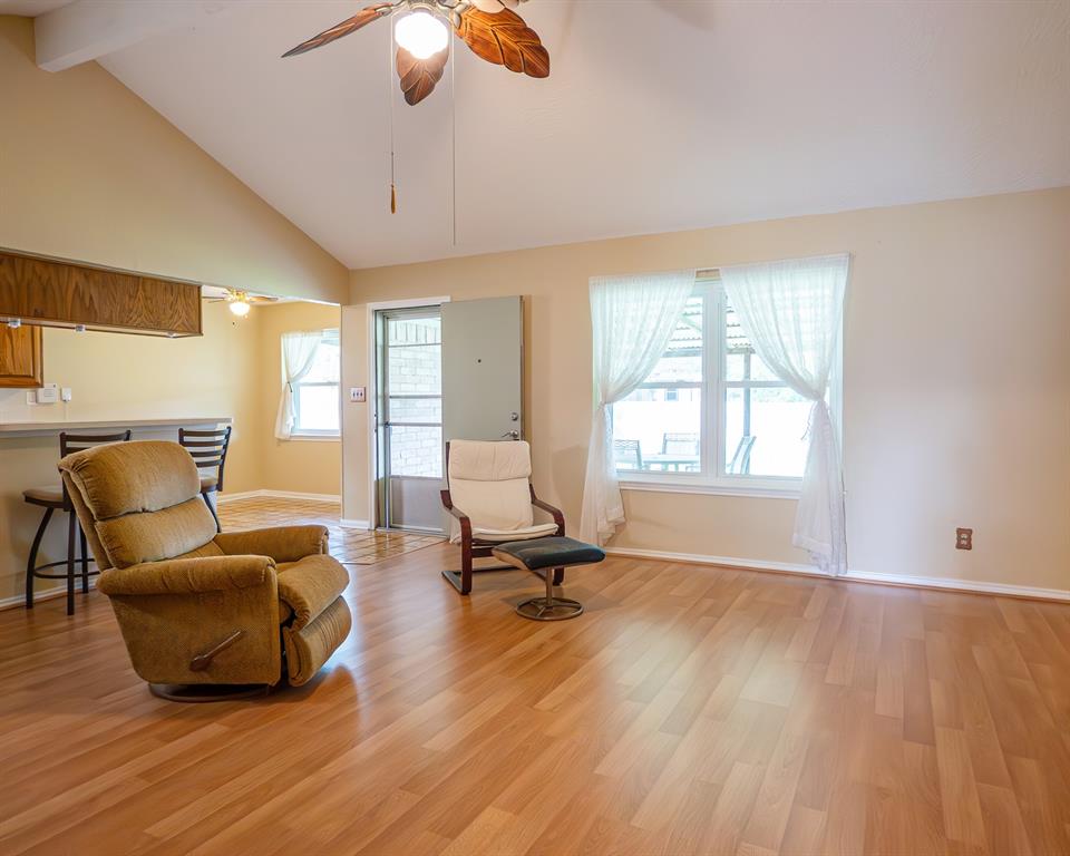 Large living room with access to covered back porch