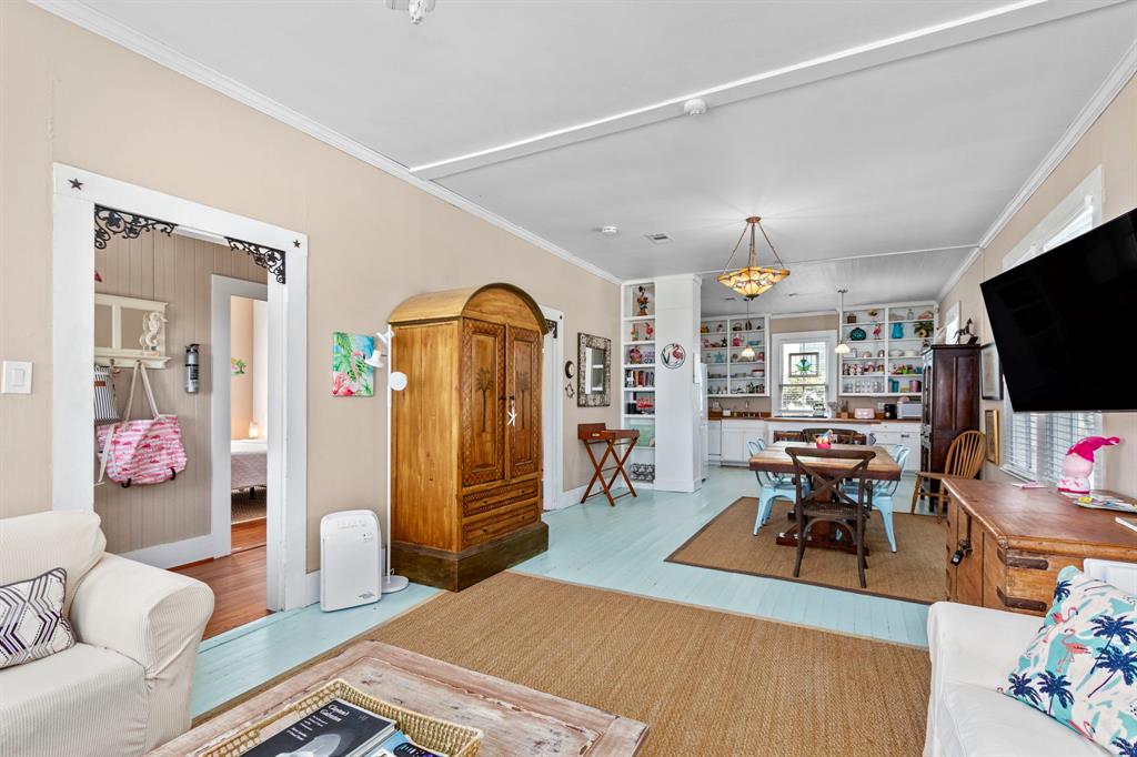 Painted floor and light open floor plan makes this living space and dining space flow well for large groups!