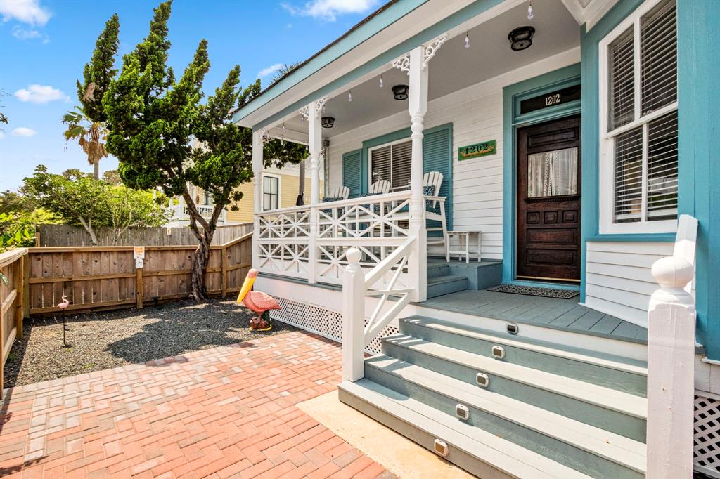 Notice the Coastal cross railing and historic gingerbread trim on this adorable charmer.