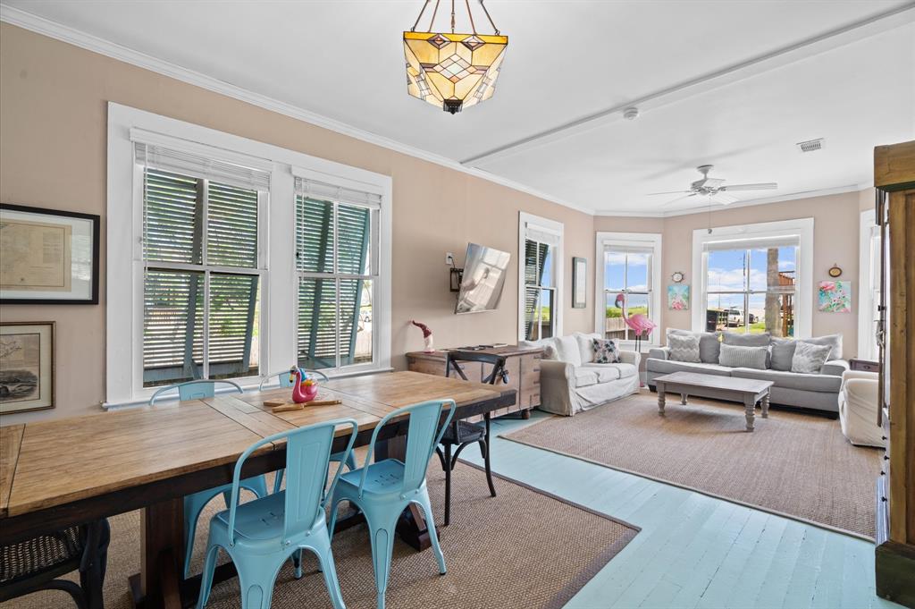 Love the painted floors on this beach house! Notice the louvered shutters reminiscent of South Florida!