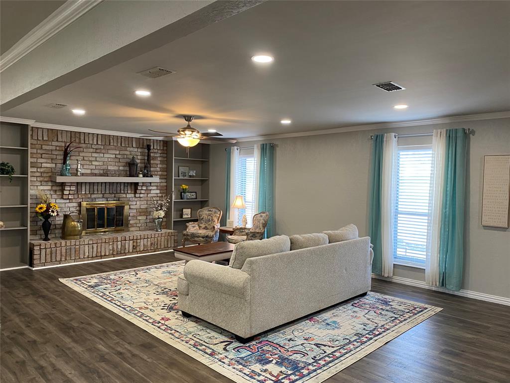 Living room with built in shelves and WBFP with blower.