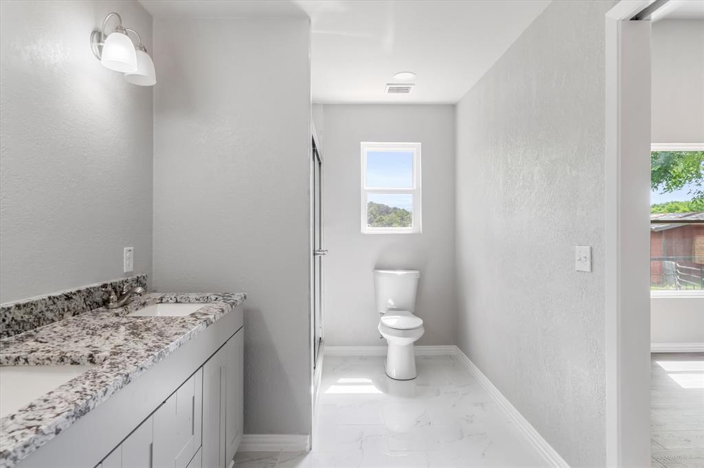 Another view of primary En suite with oversized rain head shower.