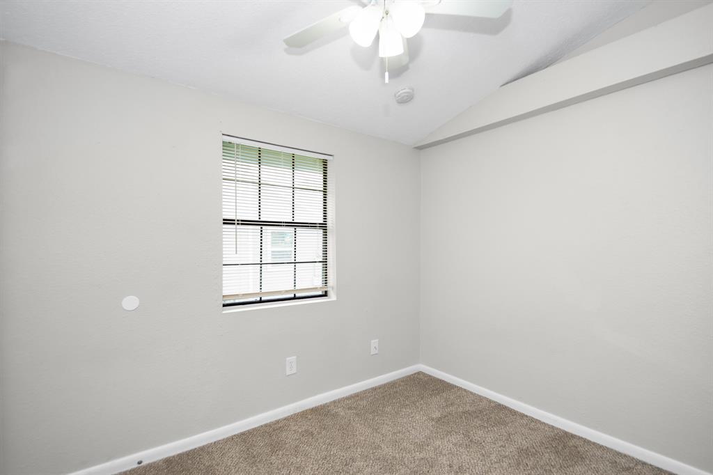 Secondary bedroom located across the half bath.