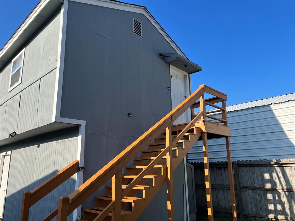 Walk up the restained stairs to Unit A.