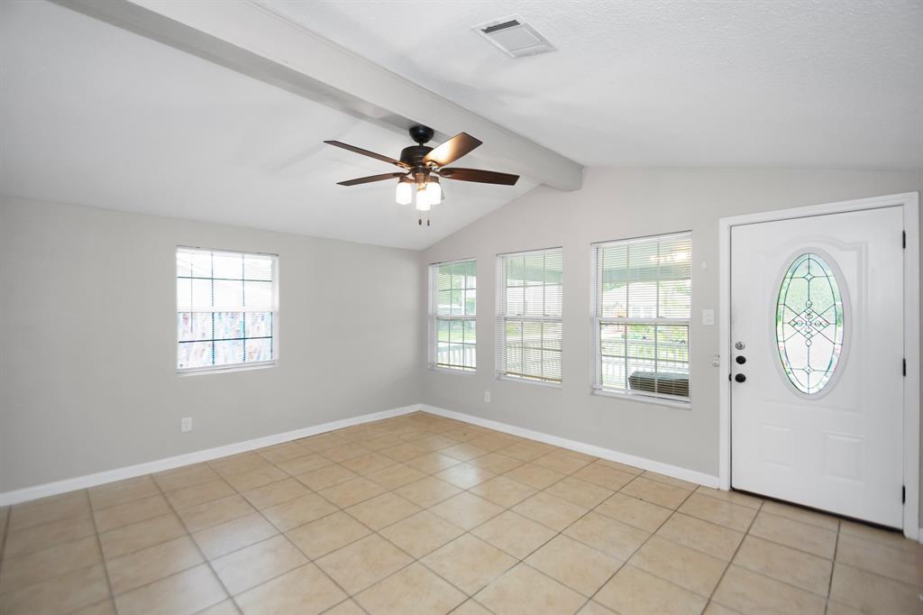 Step into the 15x13 living room with plenty of natural light from all the windows.