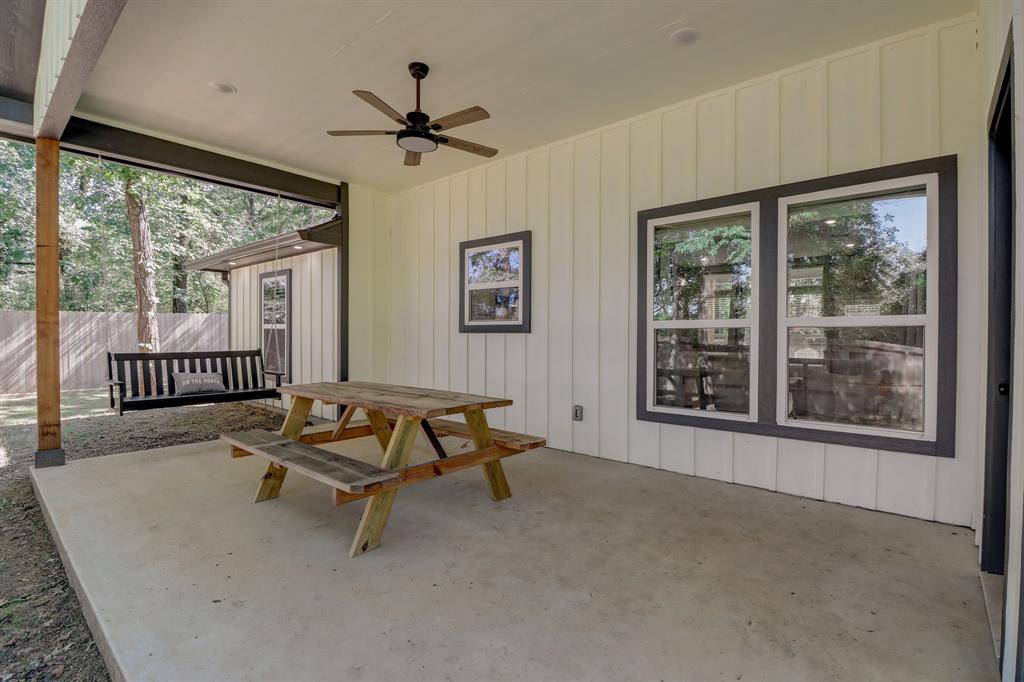 Spacious covered patio at rear of home