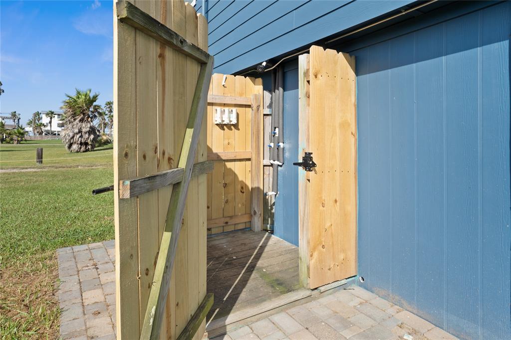 OUTDOOR SHOWER CONVENIENTLY LOCATED ON THE BACK OF THE HOUSE. PERFECT PLACE TO WASH UP BEFORE GOING INSIDE.