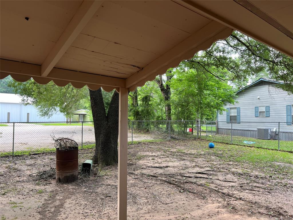 Back Porch looking to the Right is a Neighbor\'s Home. There is Parking for a Church behind home.