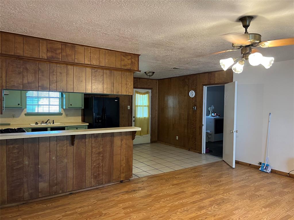 Living Room looking toward Kitchen, Dining Room and Back Door to Fenced in Yard