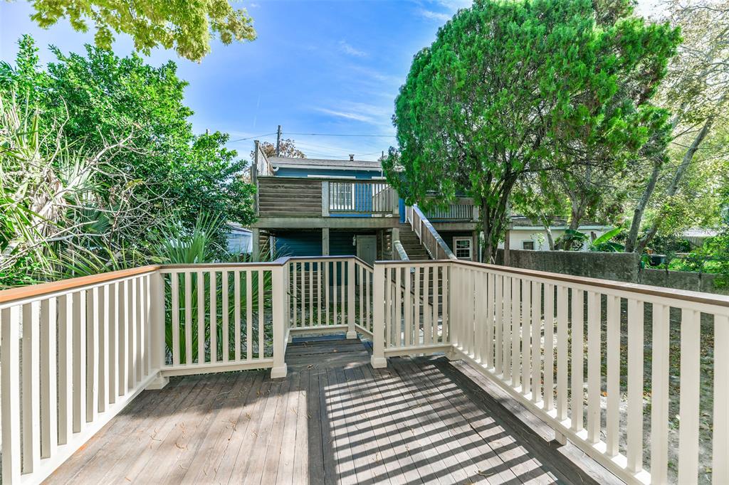 Deck off the kitchen overlooking backyard.