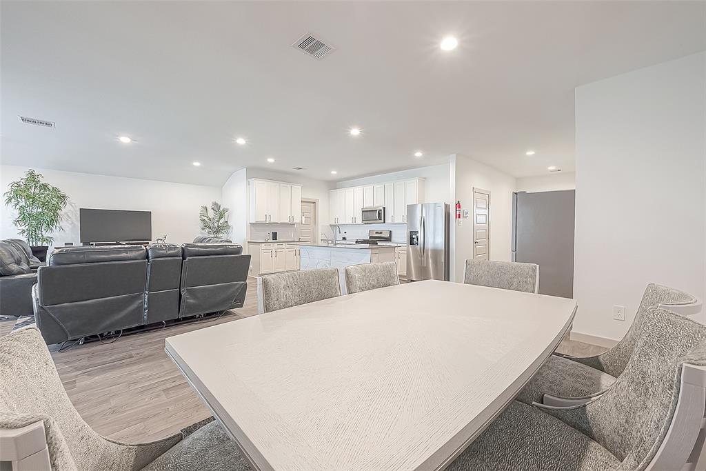 Dining room open to living room and kitchen