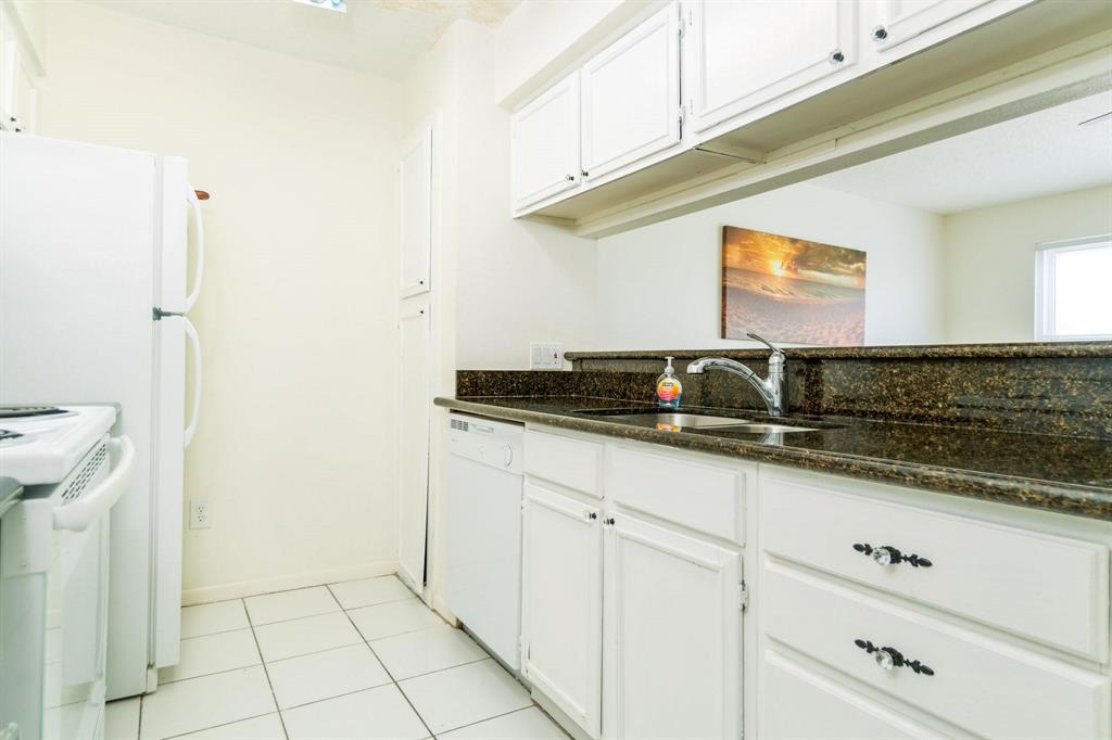 Kitchen overlooks formal living room.