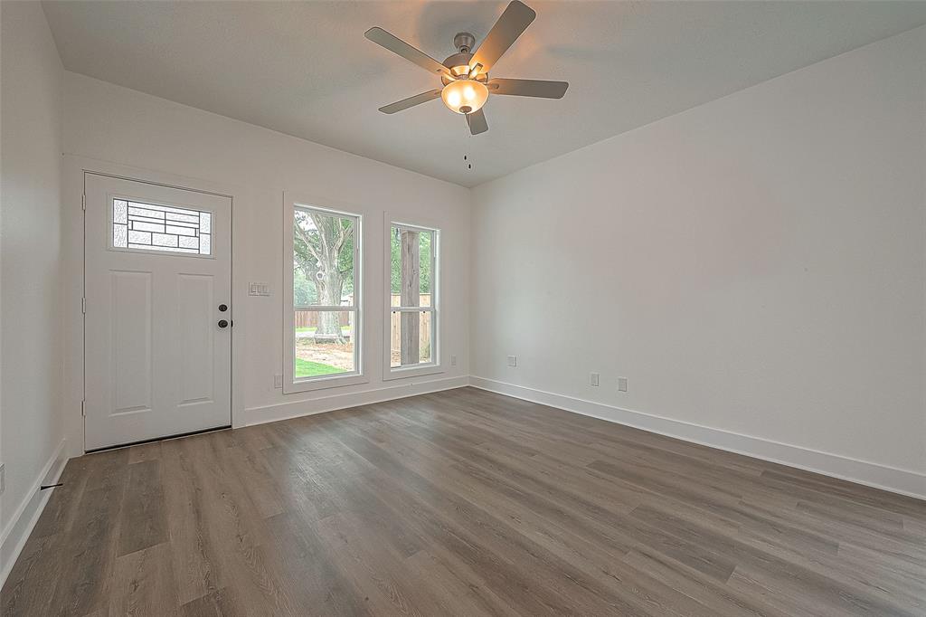 The door in the living room leads directly to the spacious backyard.