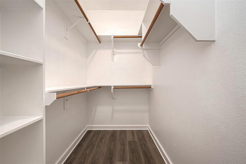 An abundant walk-in closet has plenty of space for storing your clothes and other belongings.