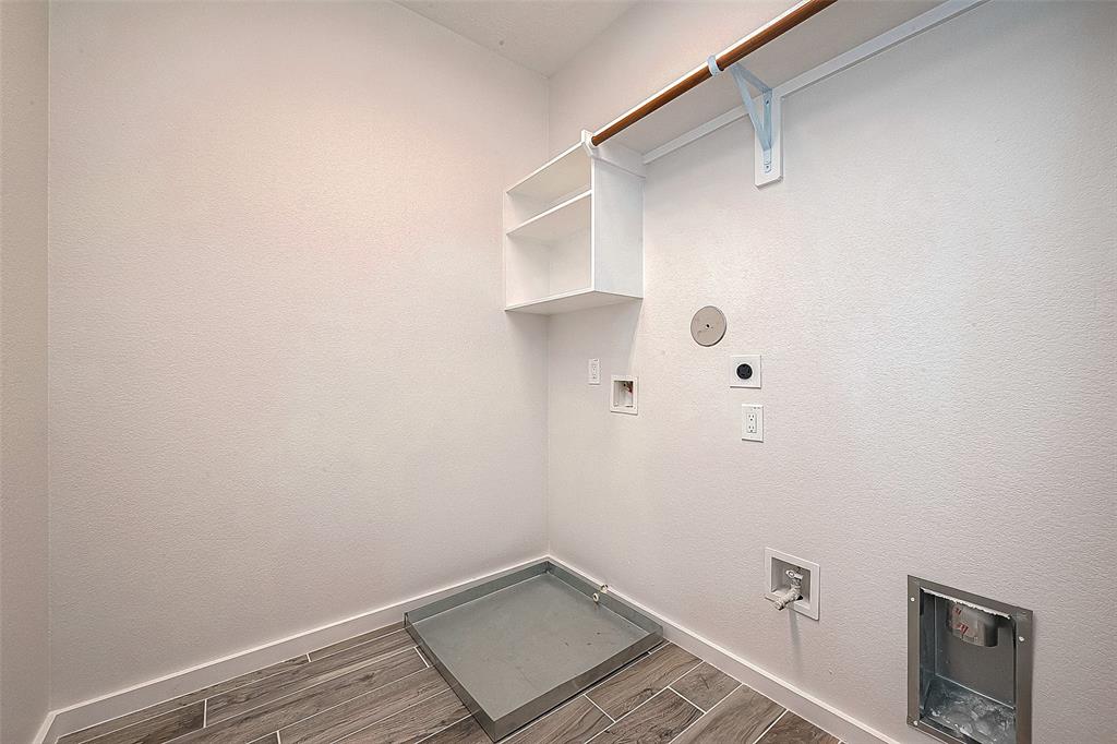 The utility room in the house is conveniently positioned, making it easily accessible for carrying out daily tasks.