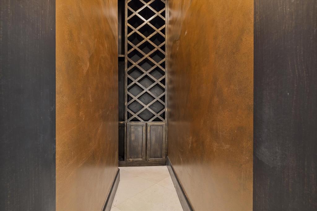 A wine room found off kitchen to showcase wine collection.