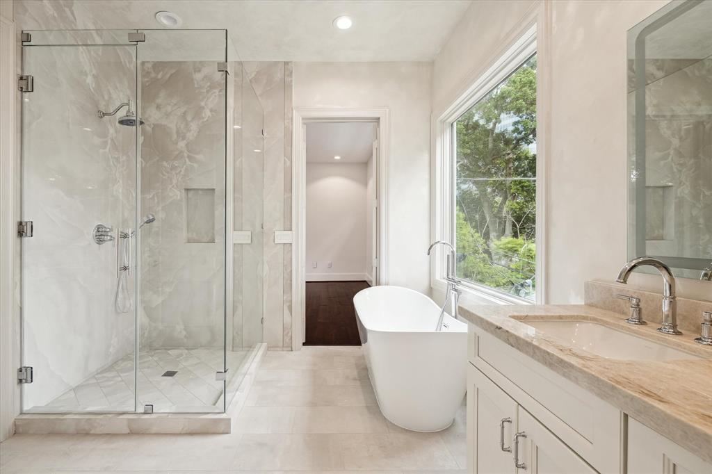 A light and bright secondary primary bathroom suite with soaking tub.