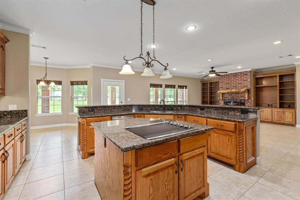 Natural light streams into this gorgeous kitchen. The open floor plan allows you to stay in touch with family and friends during meal prep time. Did I mention the size of the breakfast bar?