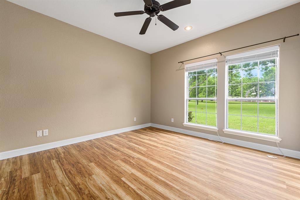 Bedroom 2. All secondary bedrooms are generously sized and feature ceiling fans and large walk in closets.