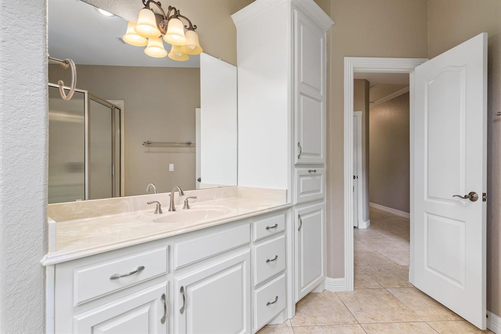 The second of 2.5 baths features a large walk in shower. There is a window that allows natural light to stream into this space.