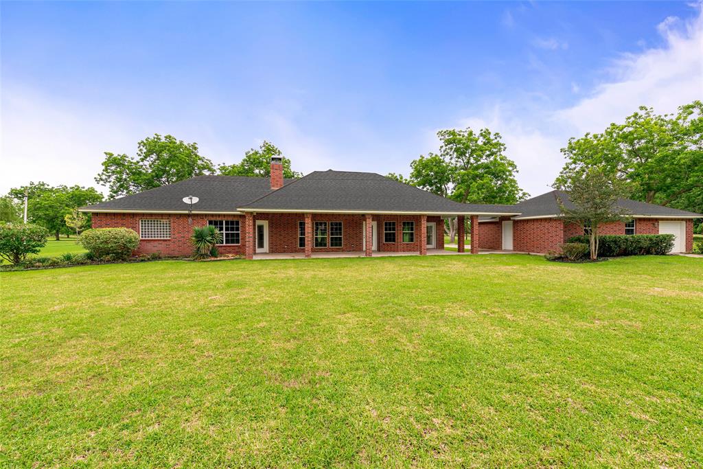 This view reflects the walls of windows and French doors that bring the outdoors in on this gorgeous home. Outdoor living space for a Texas size barbeque! Your home will be “the” gathering place of family and friends.