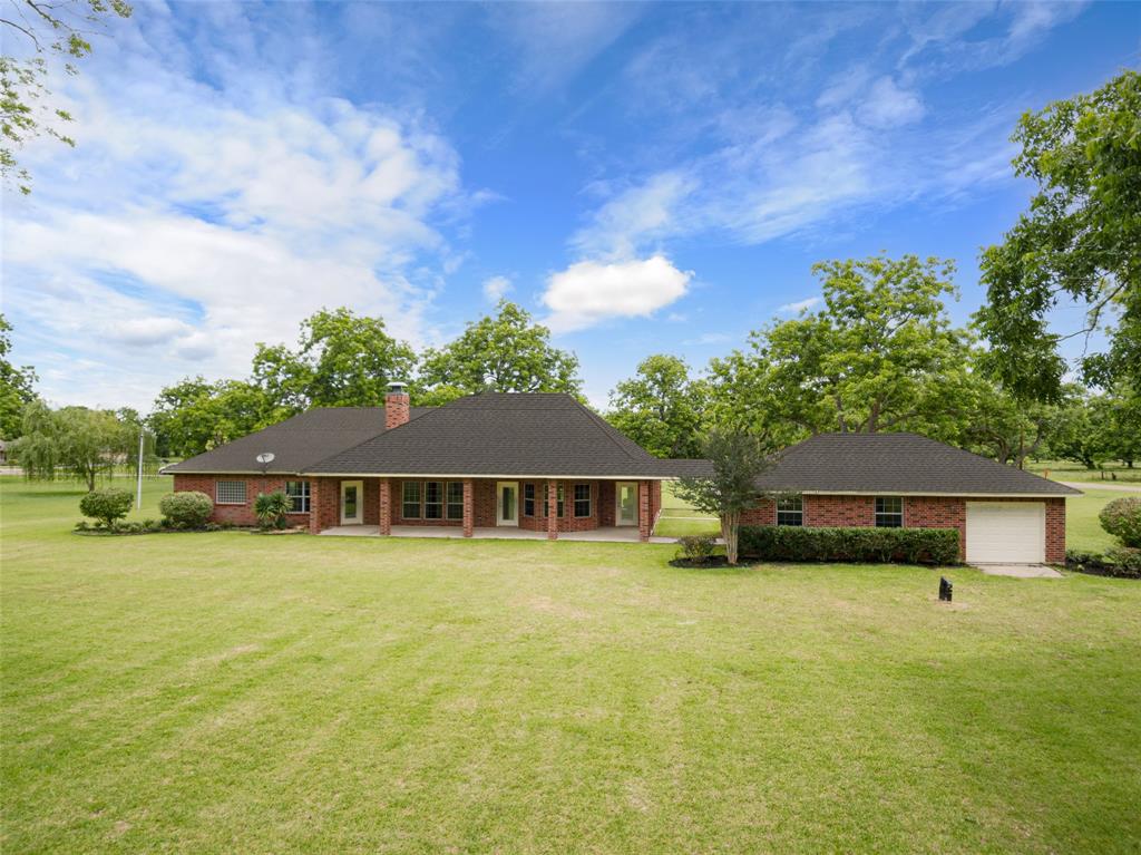 4 side brick and cement board, whole yard irrigation system make for carefree maintenance on this beautiful country home. Note the 3rd garage door on the oversized garage.