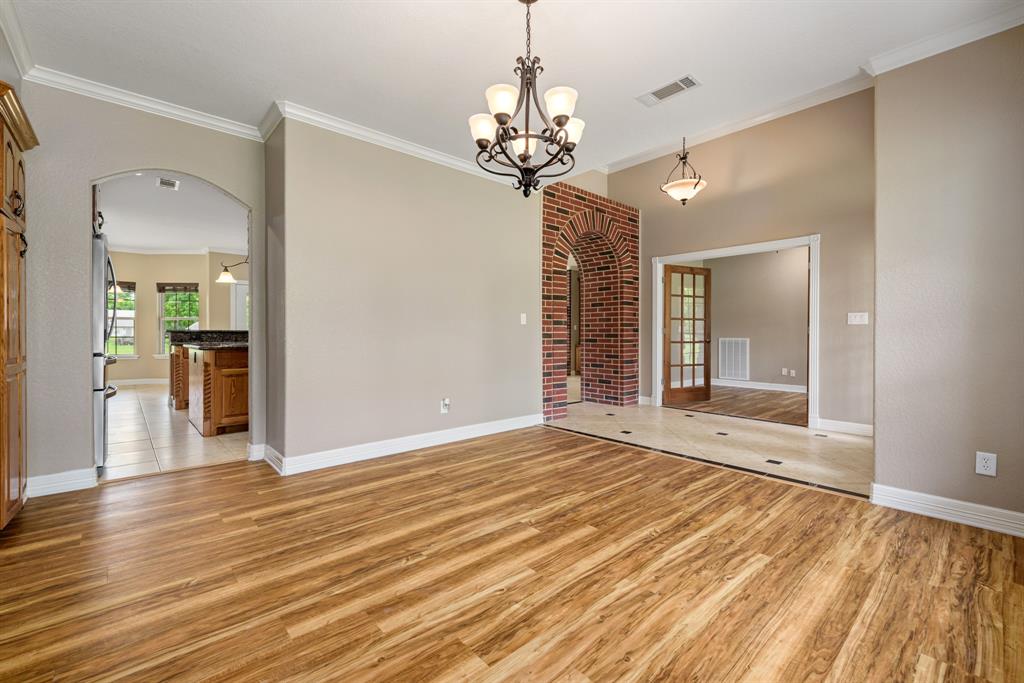 This beautiful light filled dining room will accommodate the largest of dining tables with ample room for side pieces. If formal dining is not needed this would be perfect as a third living area/flex space.